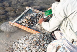 Sorting and picking of valuable stones from the excavations debris of swat emerald mine in swat valley, Pakistan.