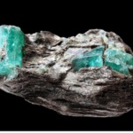 An emerald gemstone in organic condition