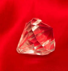 Diamond lying on red cloth