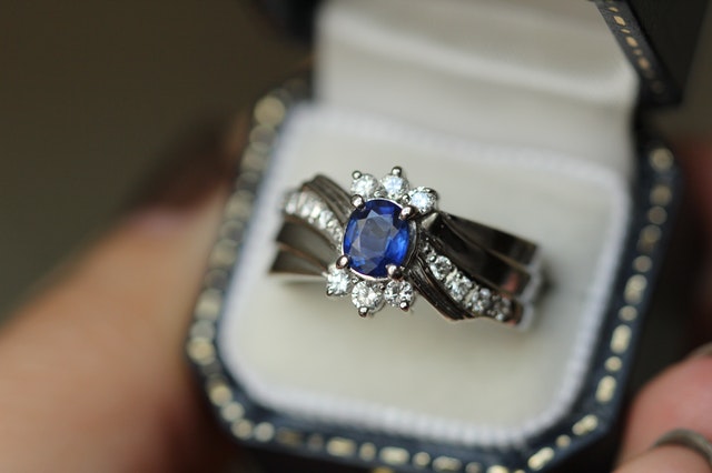 Engagement ring with blue crystal in center