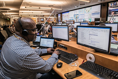 Man working on multi computers