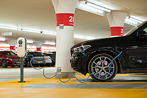 Electric Vehicle being charged in a garage