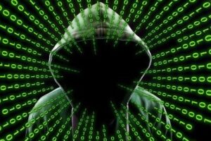 Unknown person in black sourrounded by binary code