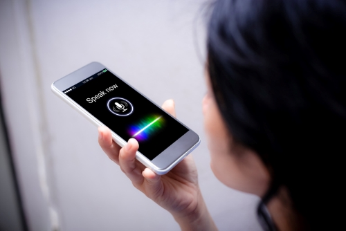 Woman speaking into a moblie phone