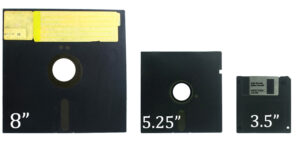 old diskettes set and flash disk isolated on white background